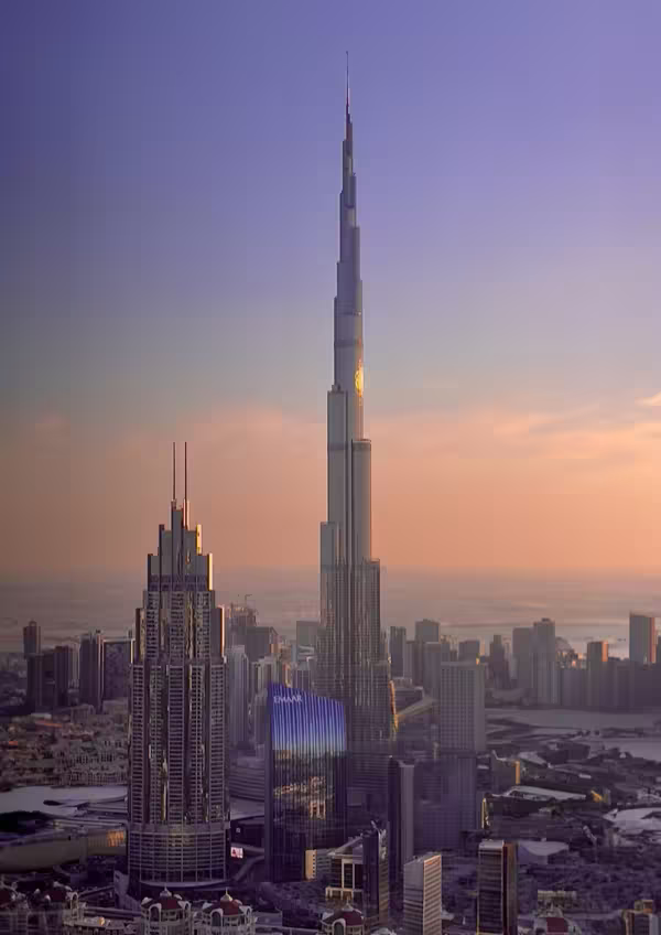 Dubai skyline with Burj Khalifa rising above the city, seen at dusk